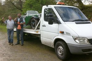 Our new recovery truck with the car on the back.